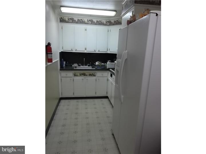 1925 Carter Road Folcroft, PA 19032 - Photo 13 of 25 a kitchen with a refrigerator and a stove
