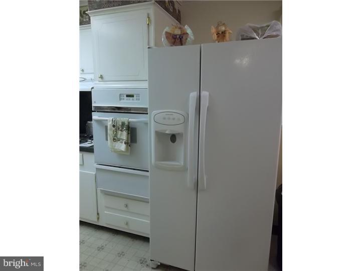 1925 Carter Road Folcroft, PA 19032 - Photo 14 of 25 a kitchen with a refrigerator and cabinets