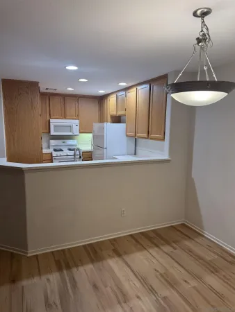 a kitchen with stainless steel appliances granite countertop a sink and cabinets