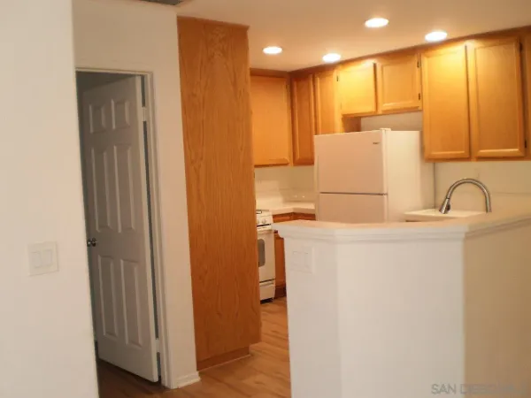 a view of kitchen with furniture and wooden floor