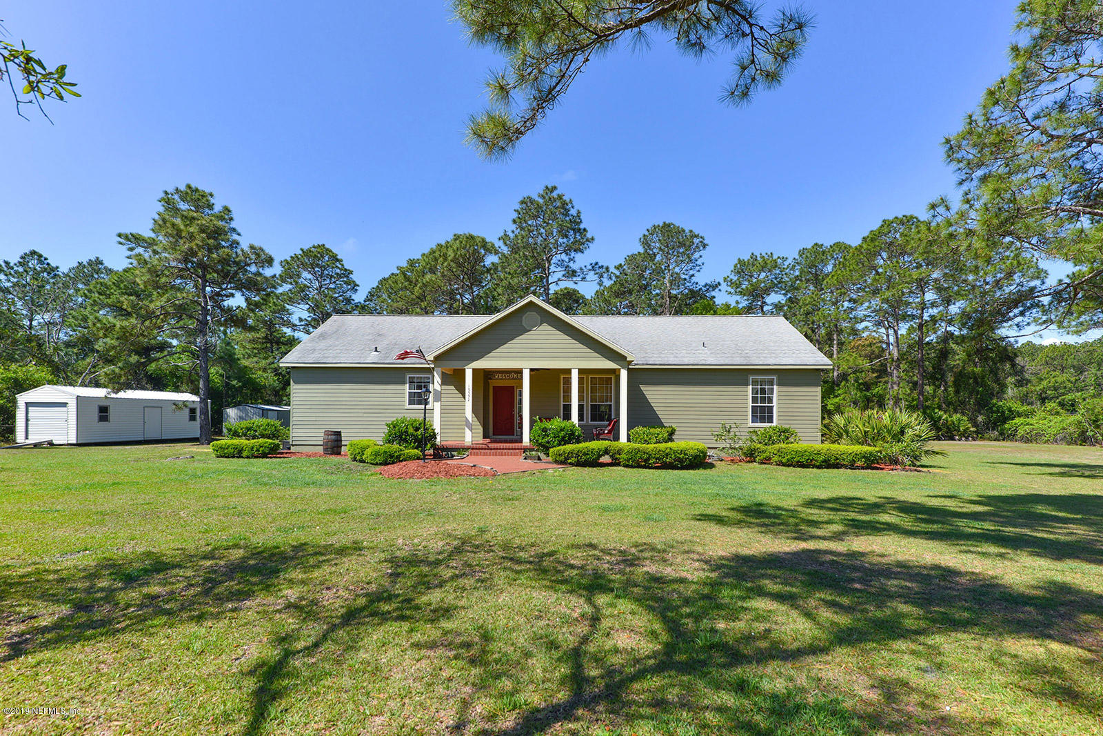 15592 Sawpit Road Jacksonville, FL 32226 - Photo 28 of 29 a front view of a house with a yard