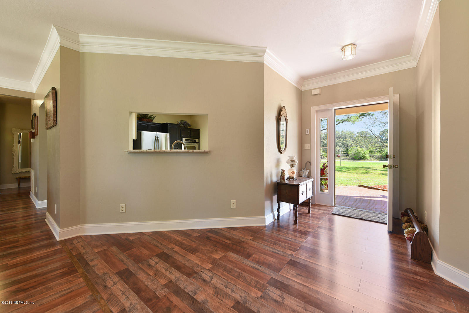 15592 Sawpit Road Jacksonville, FL 32226 - Photo 5 of 29 a view of a room with wooden floor and windows