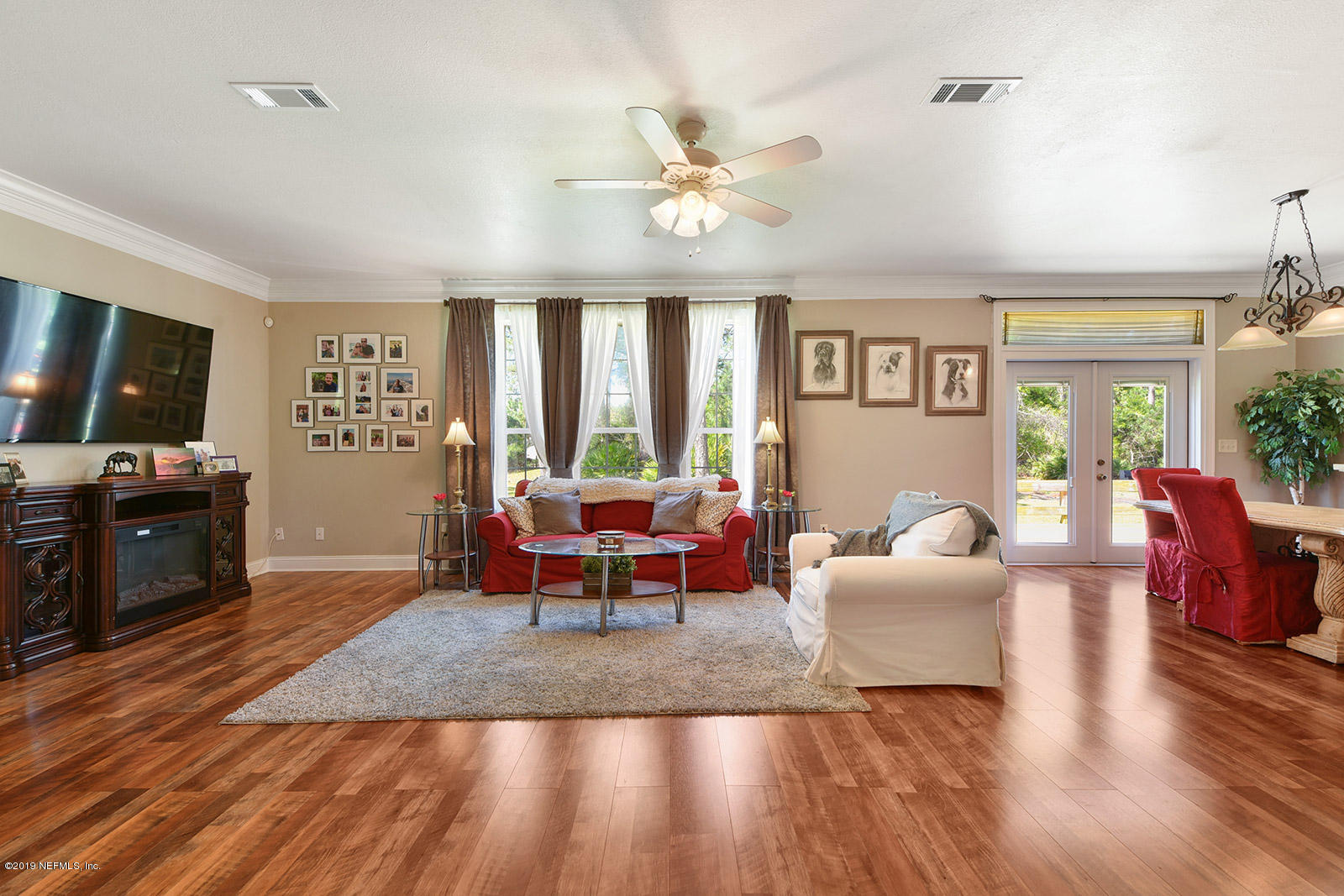15592 Sawpit Road Jacksonville, FL 32226 - Photo 6 of 29 a living room with furniture and a flat screen tv