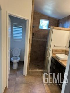 Undisclosed Address Bakersfield, CA 93313 - Photo 14 of 18 a bathroom with a toilet and a shower