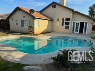 Undisclosed Address Bakersfield, CA 93313 - Photo 17 of 18 a front view of a house with a yard