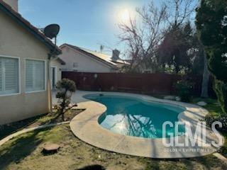 Undisclosed Address Bakersfield, CA 93313 - Photo 18 of 18 a view of a swimming pool in the backyard