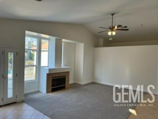 Undisclosed Address Bakersfield, CA 93313 - Photo 4 of 18 wooden floor in an empty room with a fireplace