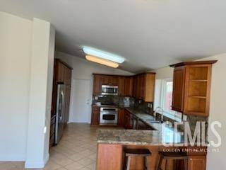 Undisclosed Address Bakersfield, CA 93313 - Photo 5 of 18 a kitchen with stainless steel appliances granite countertop a refrigerator stove and sink