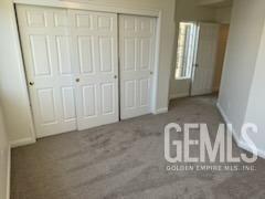 Undisclosed Address Bakersfield, CA 93313 - Photo 6 of 18 a view of an empty room with a door
