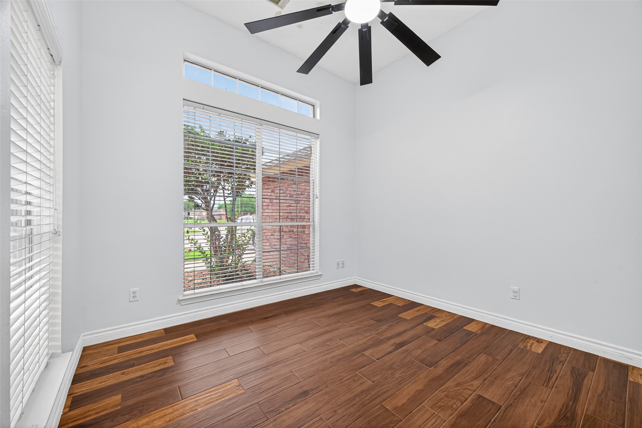 23914 Glengate Drive Spring, TX 77373 - Photo 34 of 49 an empty room with a window and a ceiling fan