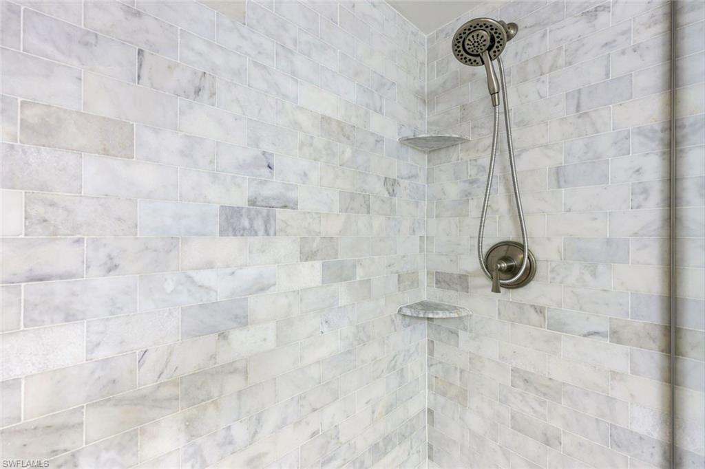 766 Central Avenue, Unit 117 Naples, FL 34102 - Photo 12 of 25 a bathroom with a shower