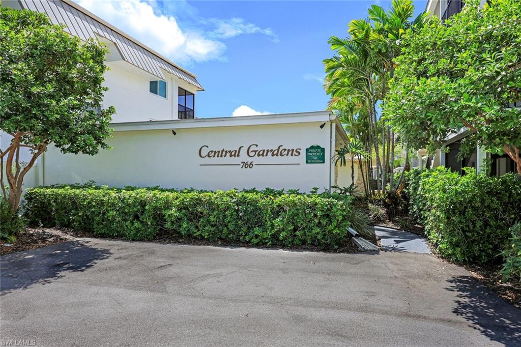 766 Central Avenue, Unit 117 Naples, FL 34102 - Photo 19 of 25 a sign on the side of a building