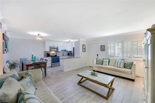 a living room with furniture and a table