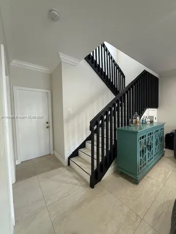 a view of entryway with stairs