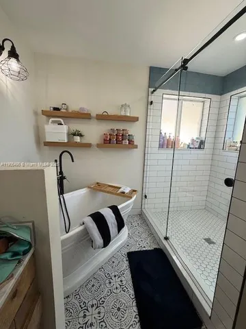 a bathroom with a sink and a shower
