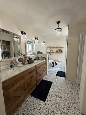 a large white room with a lot of white furniture