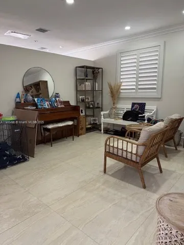 a living room with furniture and a window