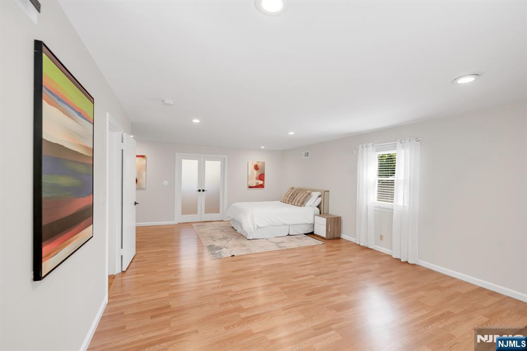 433 Piermont Road Cresskill, NJ 07626 - Photo 17 of 49 a living room with furniture and a wooden floor