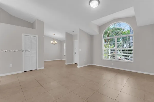 a view of an empty room with a window