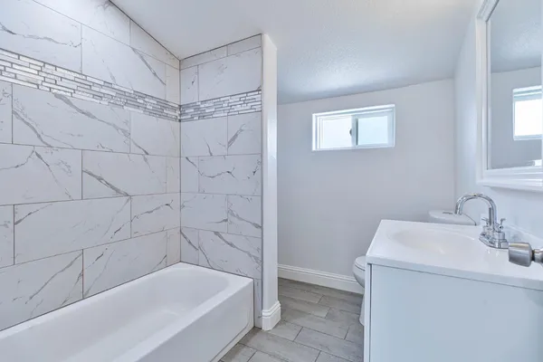 a bathroom with a sink and a bathtub