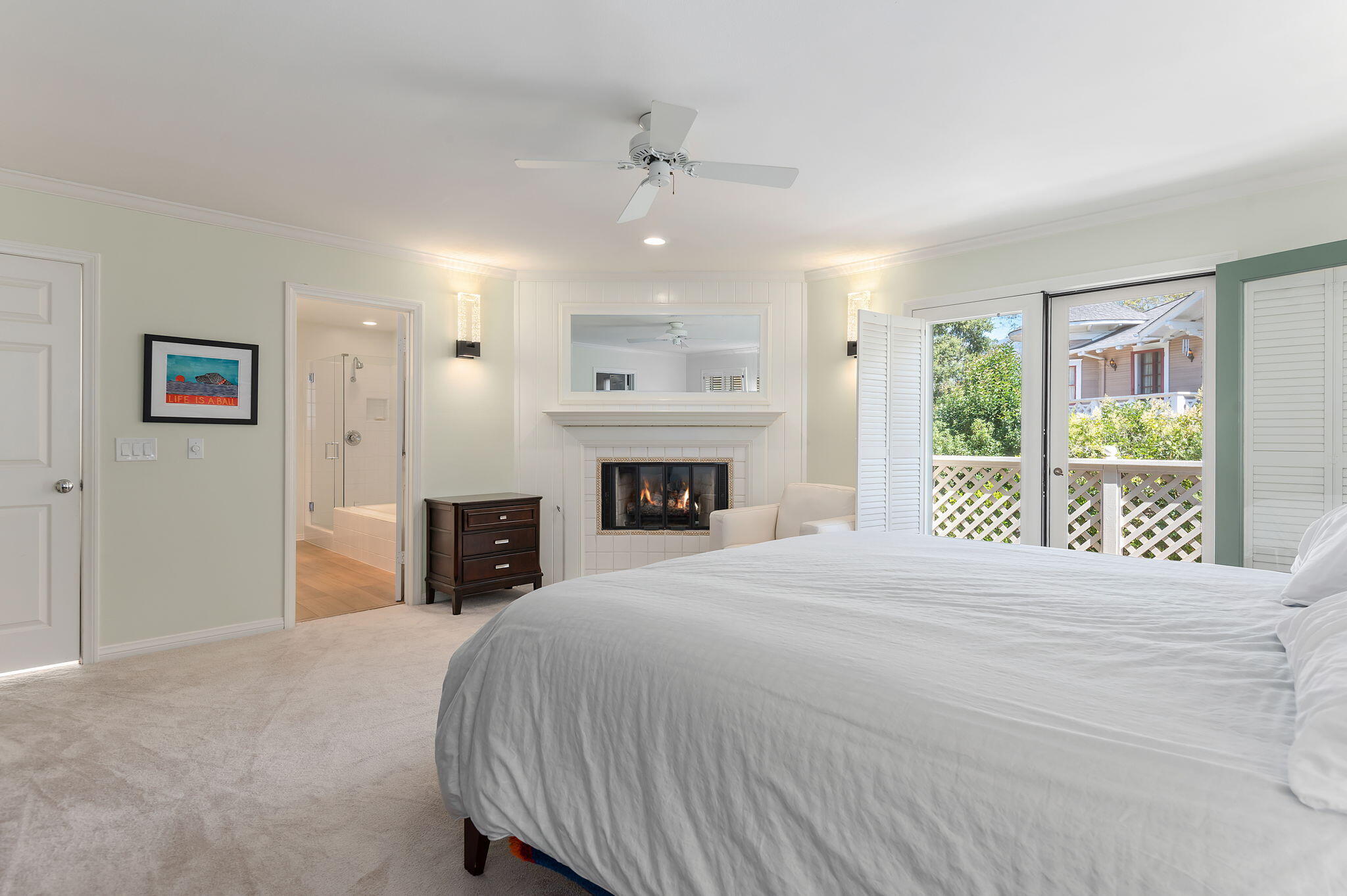 56 Olive Mill Road Santa Barbara, CA 93108 - Photo 19 of 28 a spacious bedroom with a large bed and a fireplace
