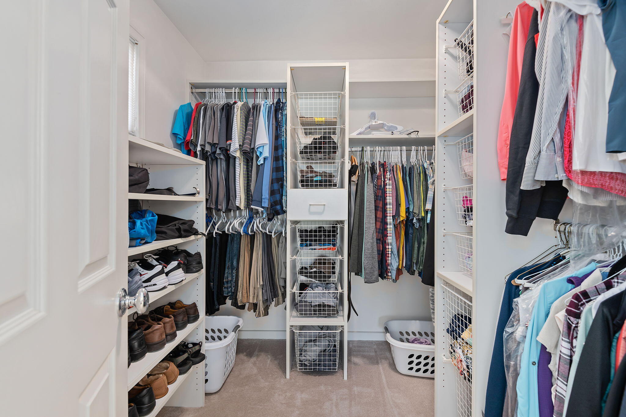 56 Olive Mill Road Santa Barbara, CA 93108 - Photo 20 of 28 a view of walk in closet with clothes and shoes