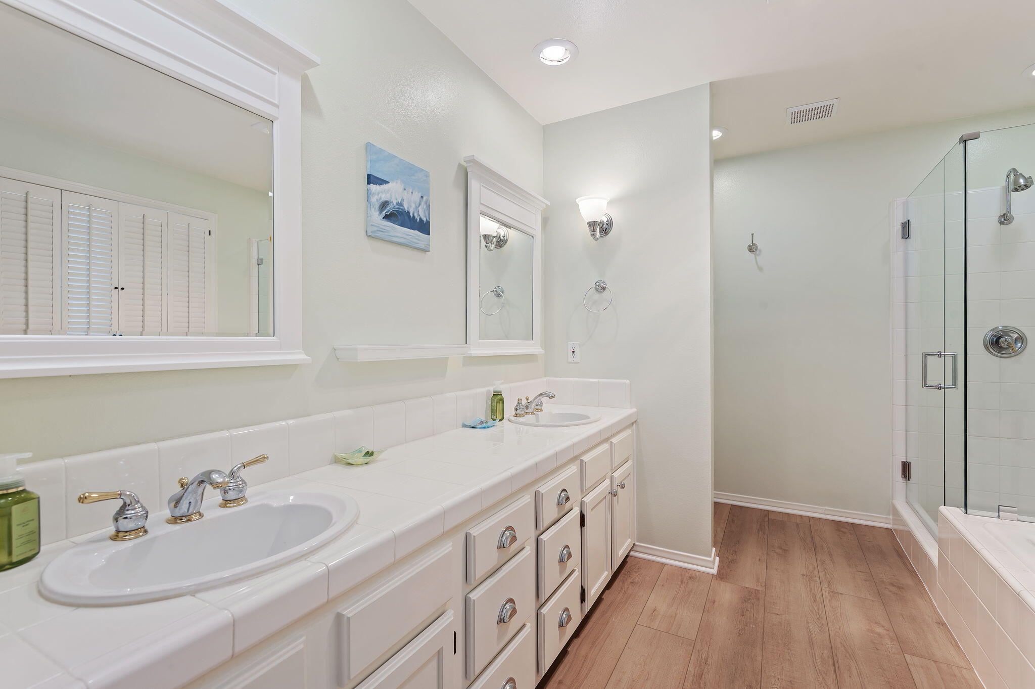 56 Olive Mill Road Santa Barbara, CA 93108 - Photo 21 of 28 a bathroom with double vanity sink and a mirror