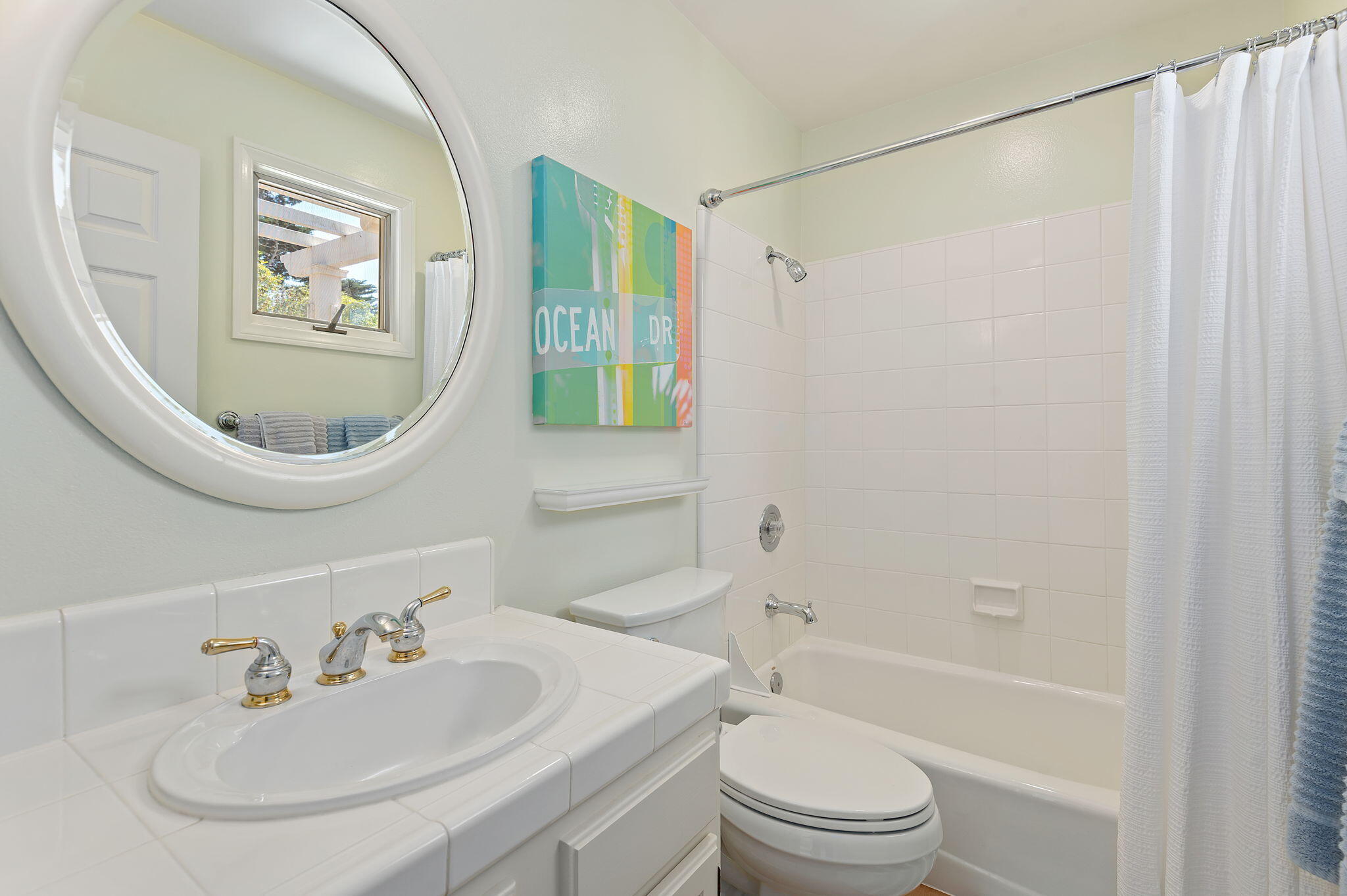 56 Olive Mill Road Santa Barbara, CA 93108 - Photo 25 of 28 a bathroom with a sink a toilet and a mirror