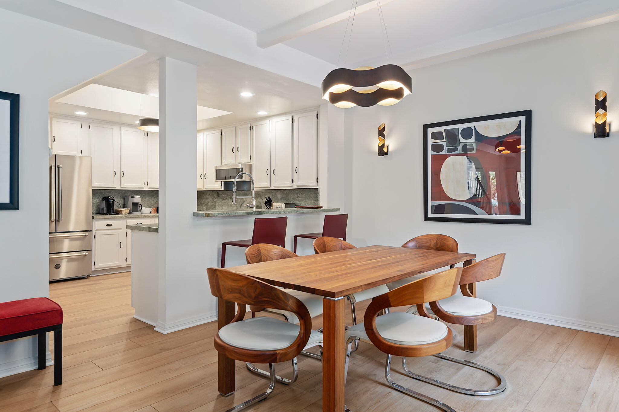 56 Olive Mill Road Santa Barbara, CA 93108 - Photo 10 of 28 a kitchen with granite countertop white cabinets and stainless steel appliances