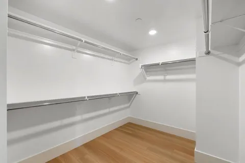 a view of an empty walk in closet