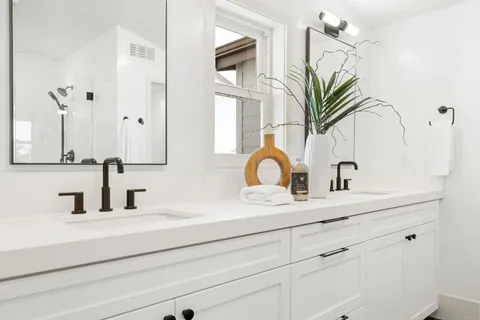 a bathroom with sink and mirror