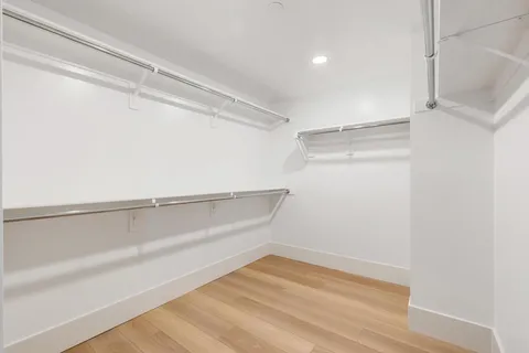 a view of an empty walk in closet