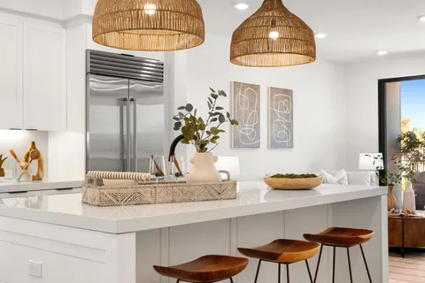 a kitchen with a table and chairs