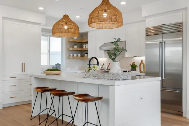 a kitchen with stainless steel appliances a sink and cabinets
