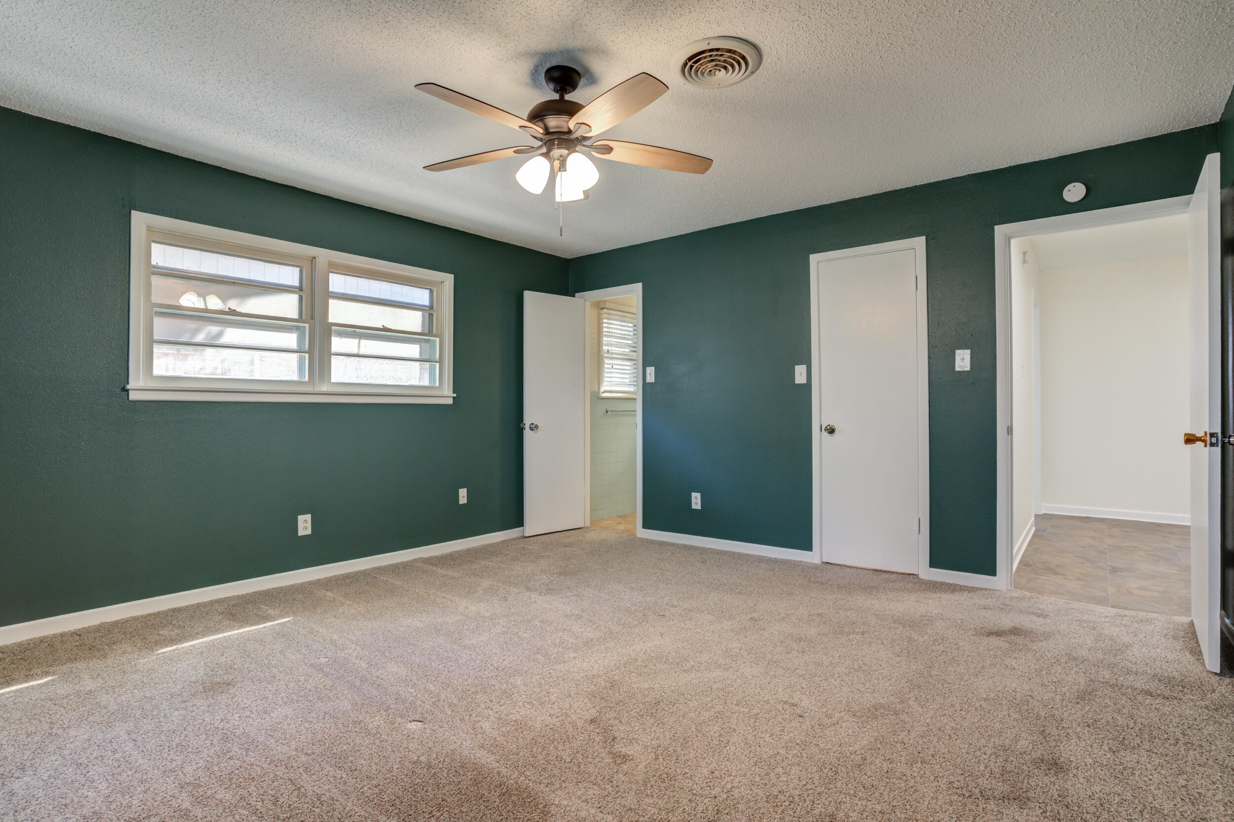 5403 8th Street Lubbock, TX 79416 - Photo 11 of 30 a view of an empty room with a window