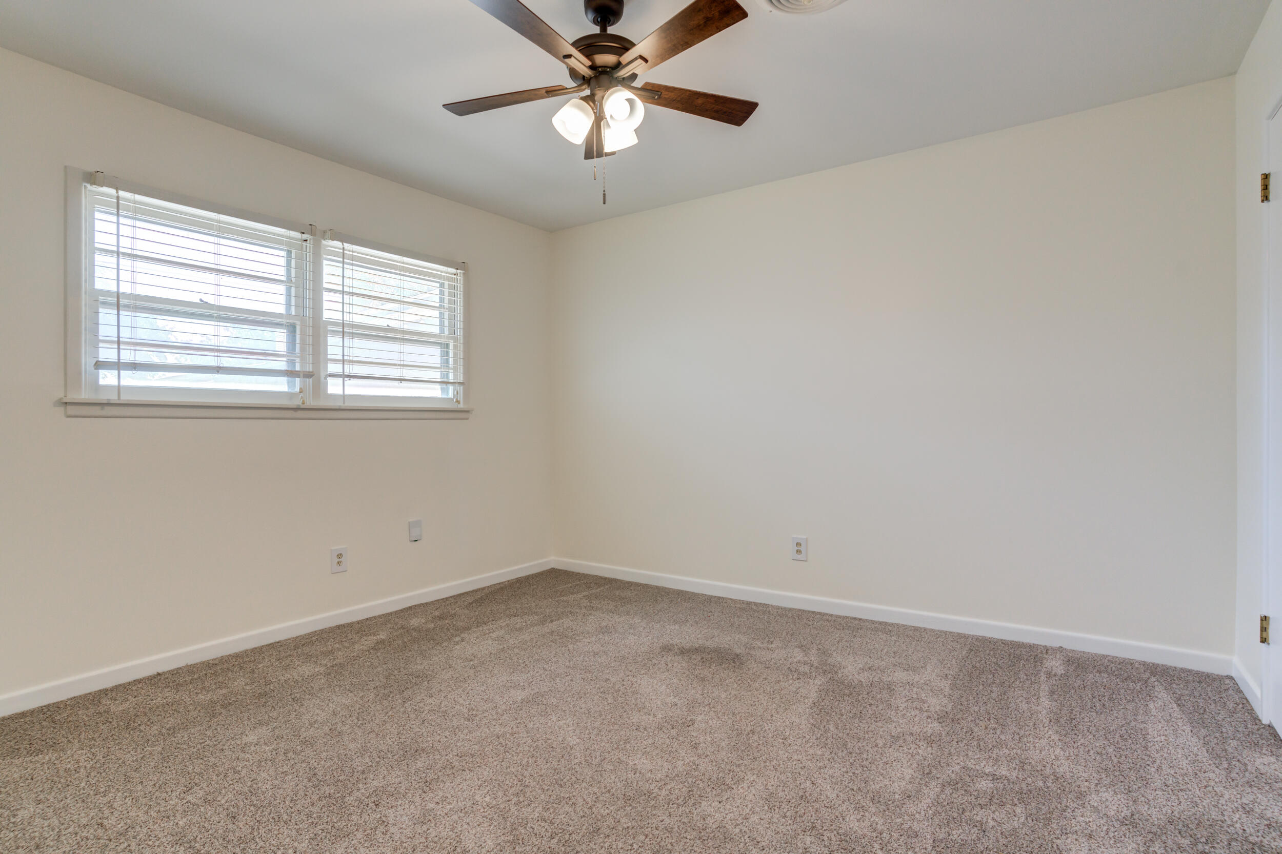 5403 8th Street Lubbock, TX 79416 - Photo 16 of 30 a view of an empty room with a window