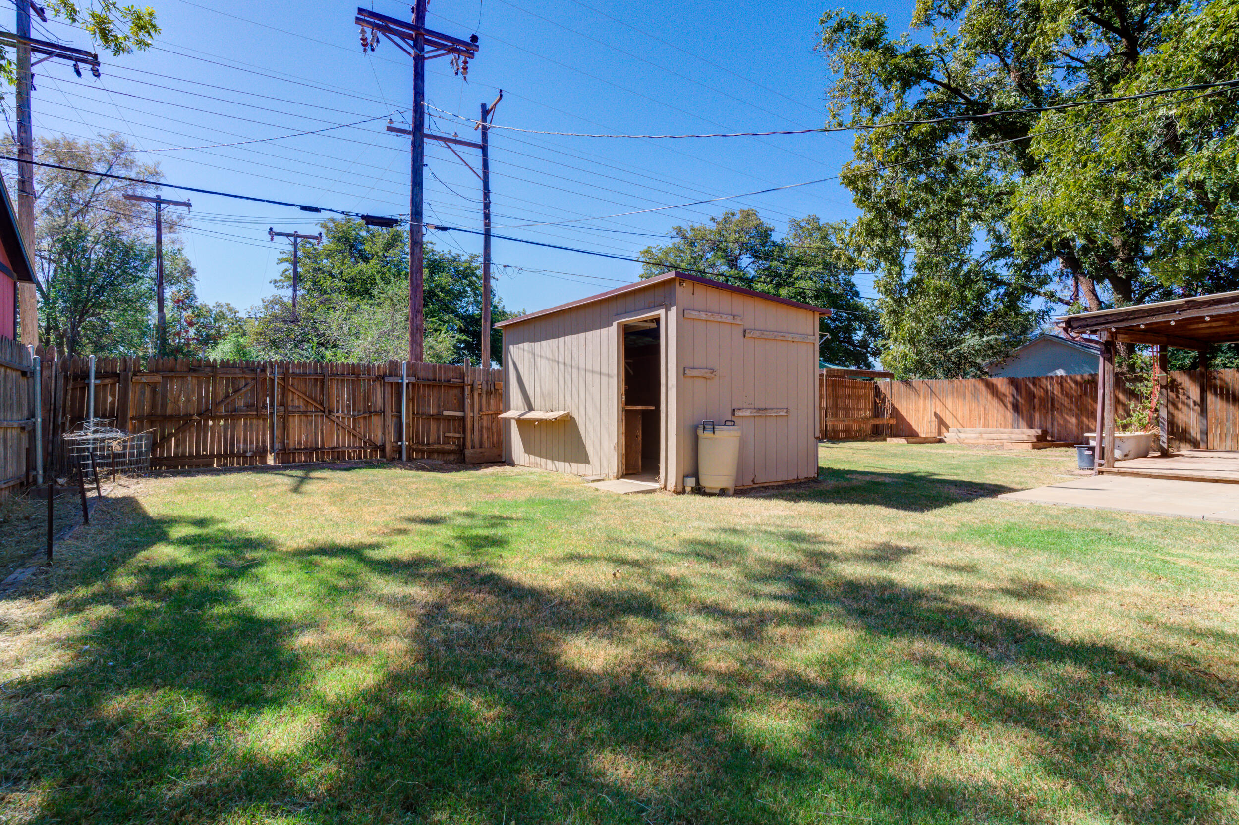 5403 8th Street Lubbock, TX 79416 - Photo 29 of 30 a view of a backyard with a tree