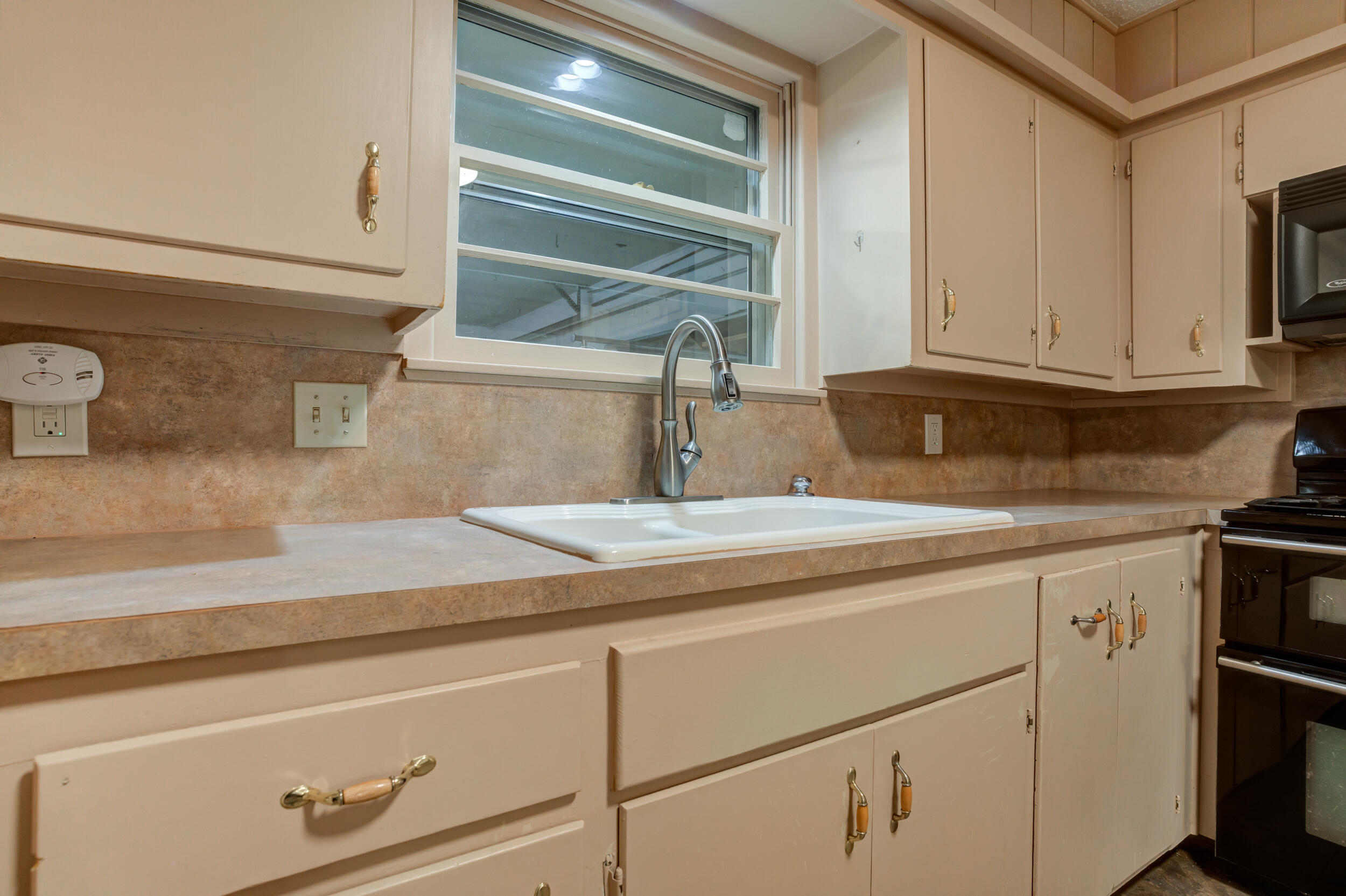 5403 8th Street Lubbock, TX 79416 - Photo 8 of 30 a kitchen with a sink and cabinets