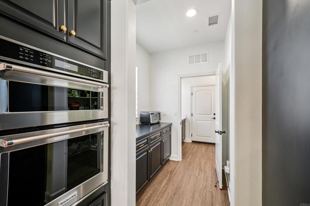 33294 Barmetta Lane Temecula, CA 92592 - Photo 12 of 36 a kitchen with a stove and a refrigerator