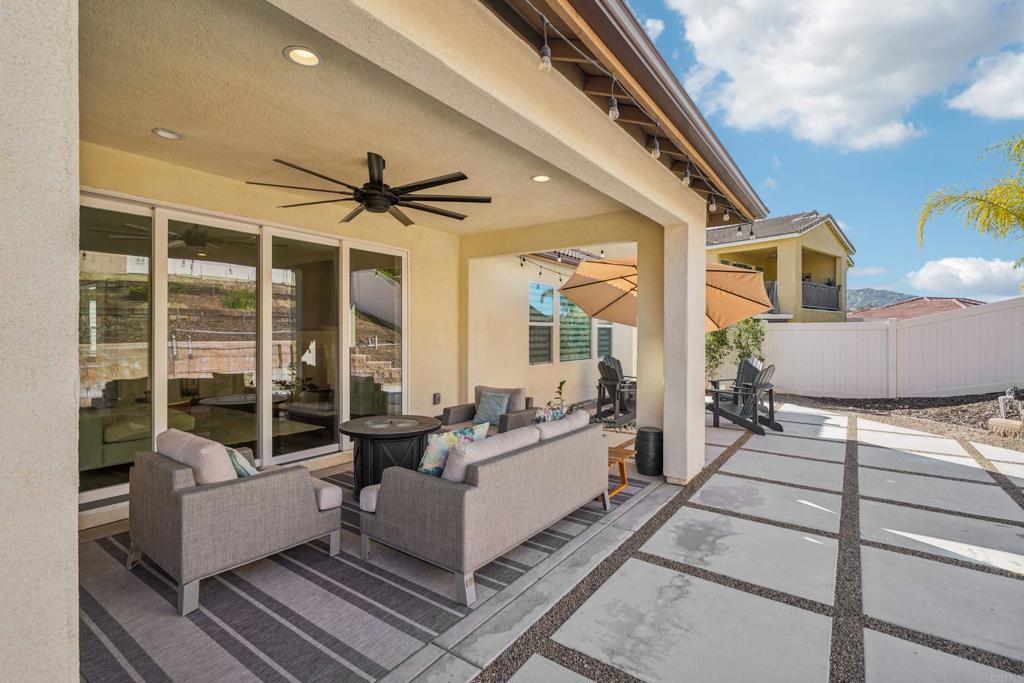 33294 Barmetta Lane Temecula, CA 92592 - Photo 25 of 36 a living room with furniture and a large window