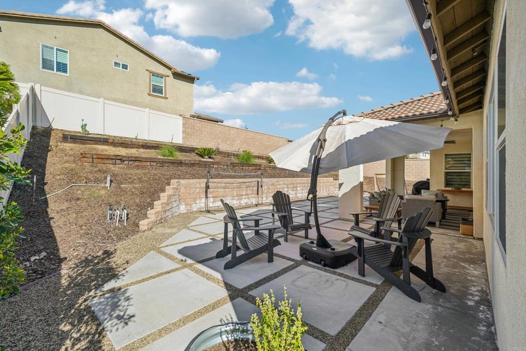 33294 Barmetta Lane Temecula, CA 92592 - Photo 28 of 36 a view of a patio with chairs and table