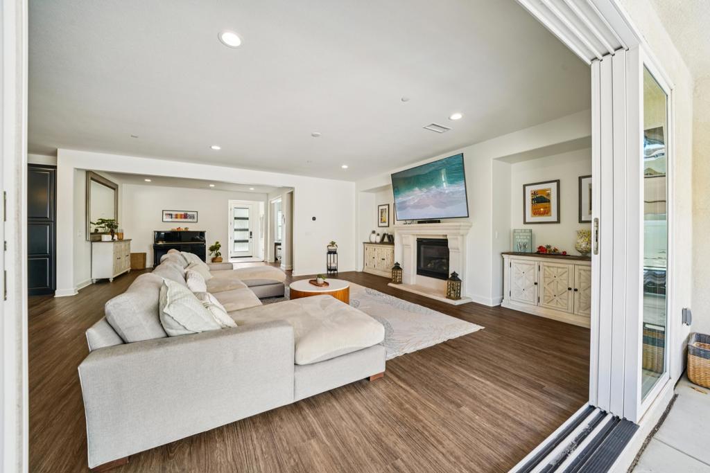 33294 Barmetta Lane Temecula, CA 92592 - Photo 4 of 36 a living room with furniture and a fireplace