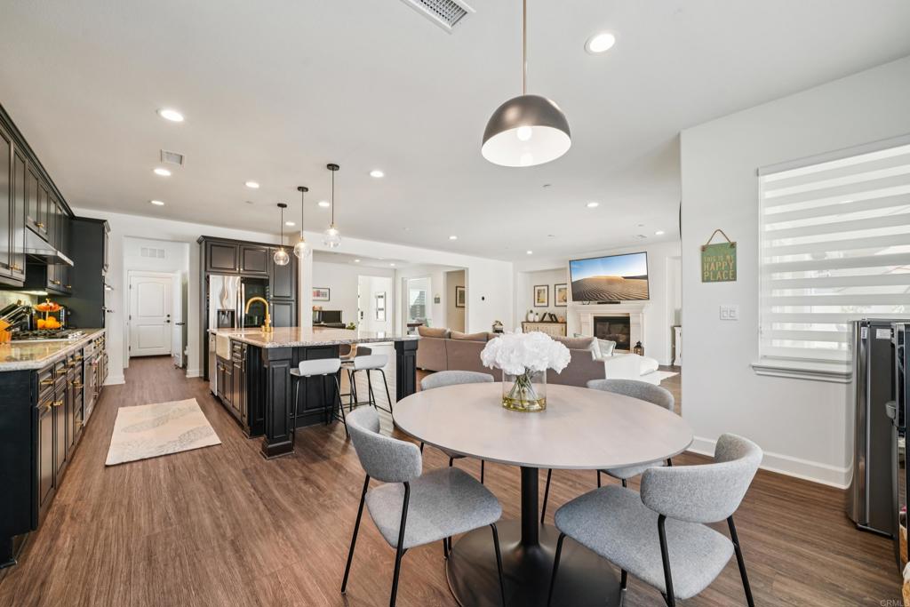 33294 Barmetta Lane Temecula, CA 92592 - Photo 6 of 36 a view of a dining room with furniture window and wooden floor