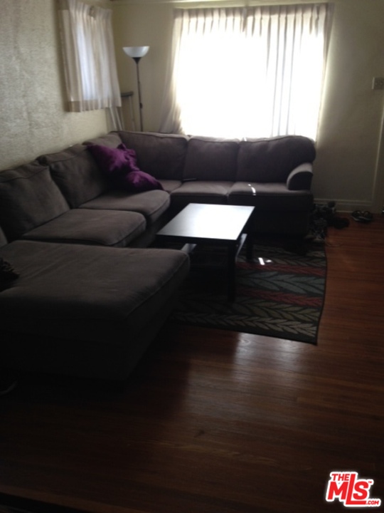 3154 Curts Avenue Los Angeles, CA 90034 - Photo 4 of 13 a living room with furniture and a window
