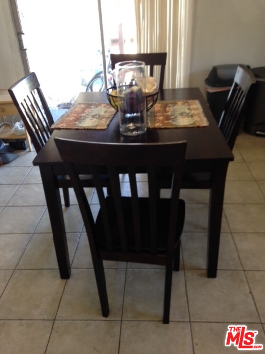 3154 Curts Avenue Los Angeles, CA 90034 - Photo 6 of 13 a view of a dining room with furniture and window