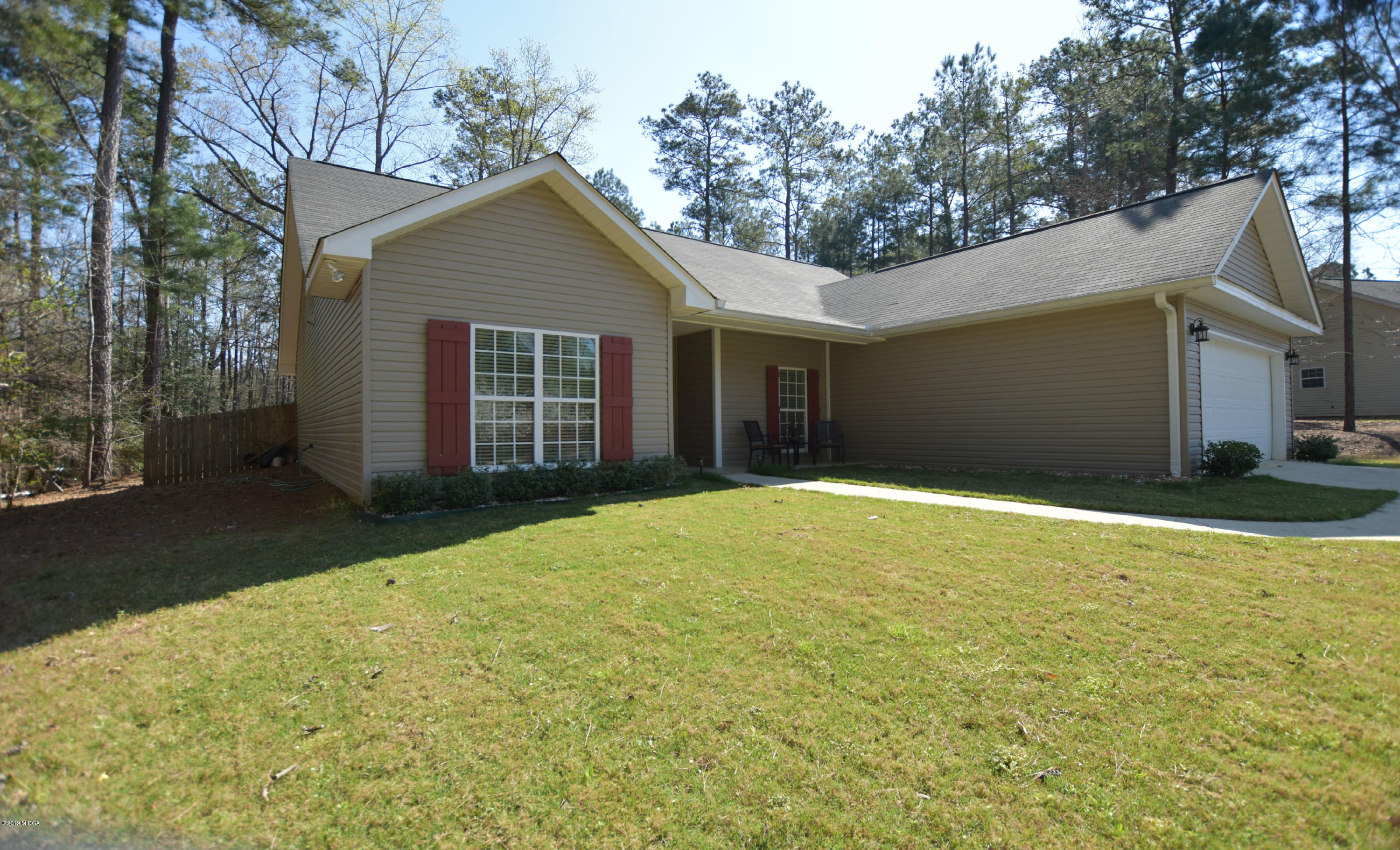 262 Ridge Point Way Macon, GA 31220 - Photo 2 of 27 a view of a house with a yard and garage