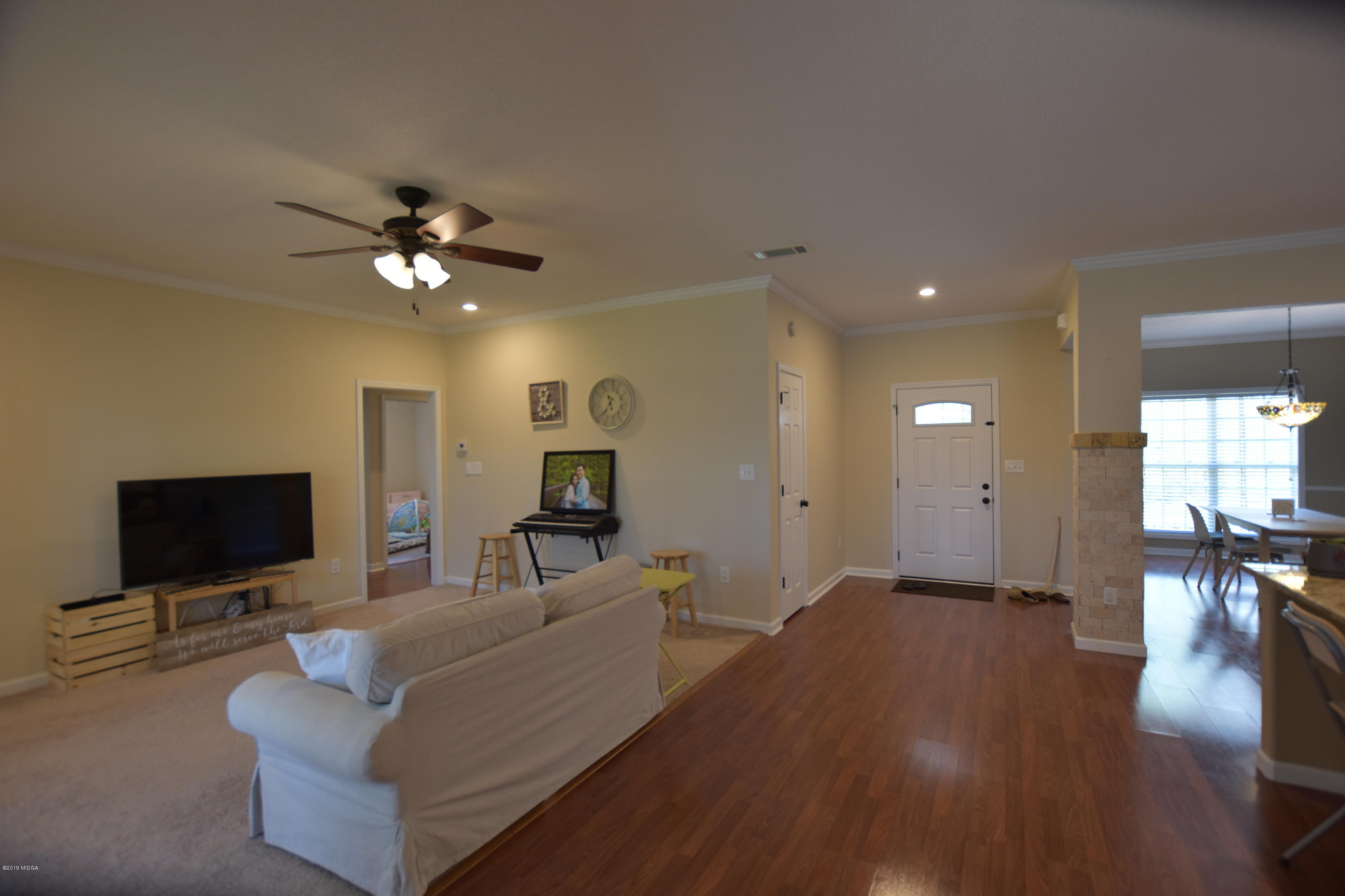 262 Ridge Point Way Macon, GA 31220 - Photo 14 of 27 a living room with furniture and a flat screen tv