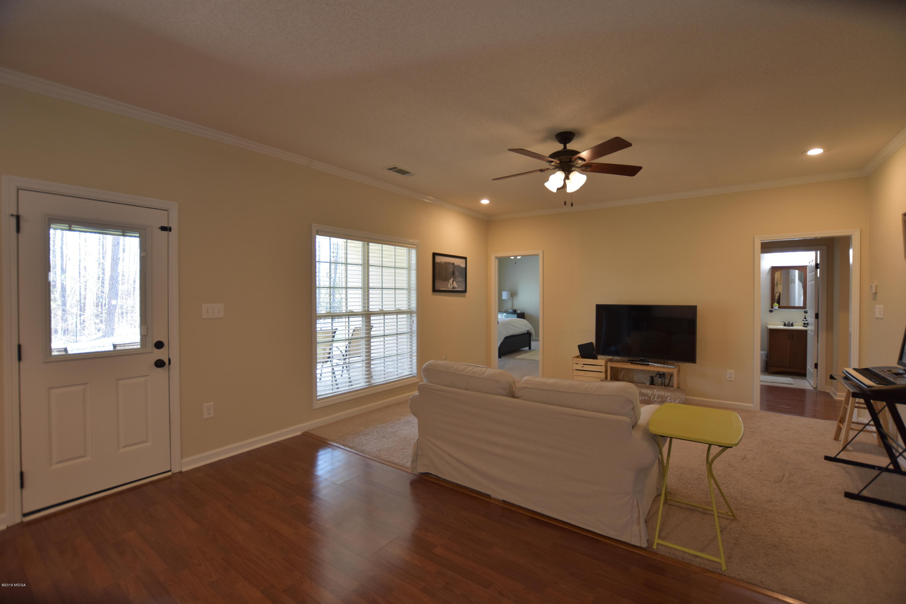 262 Ridge Point Way Macon, GA 31220 - Photo 18 of 27 a living room with furniture and a flat screen tv