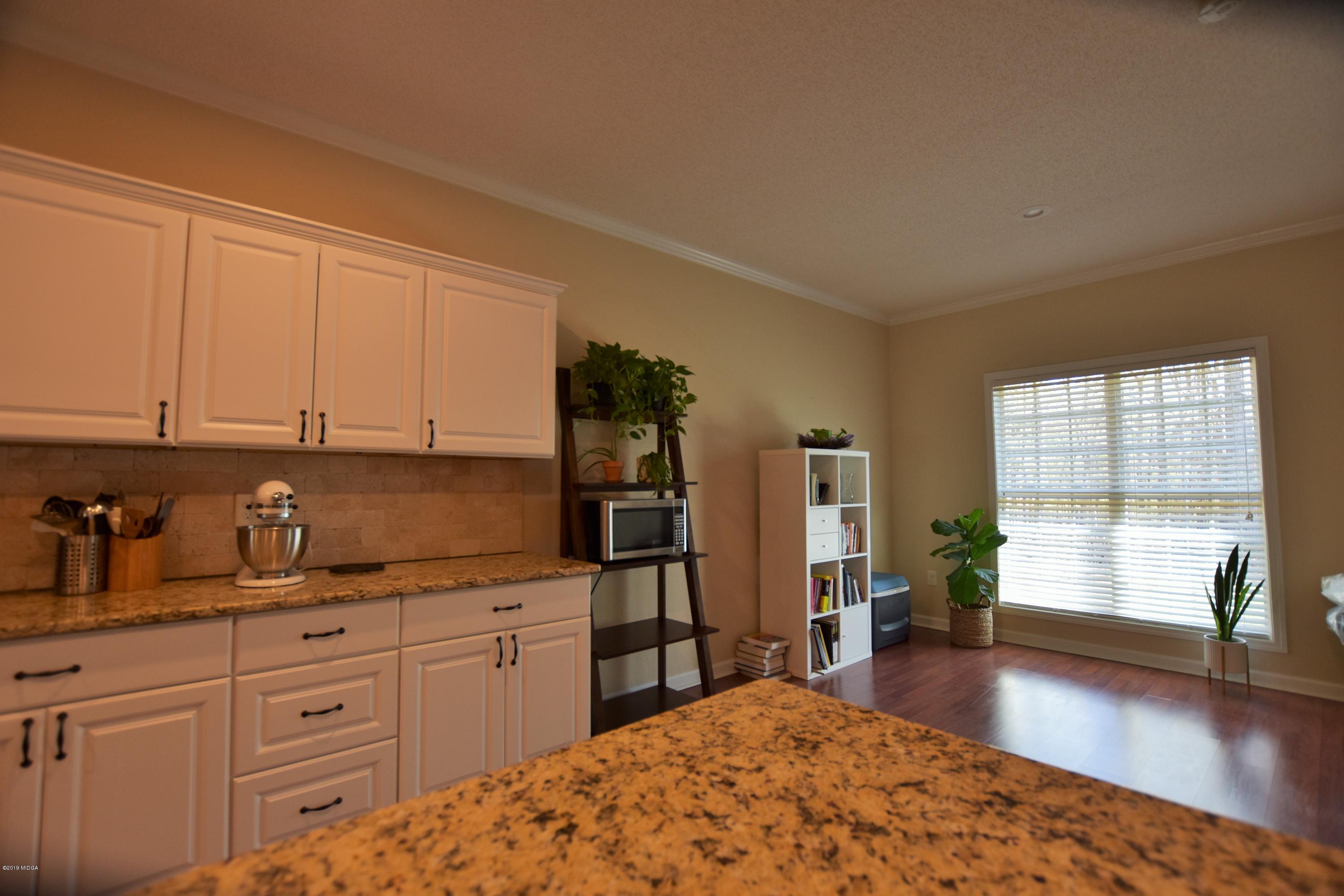 262 Ridge Point Way Macon, GA 31220 - Photo 10 of 27 a kitchen with sink and cabinets