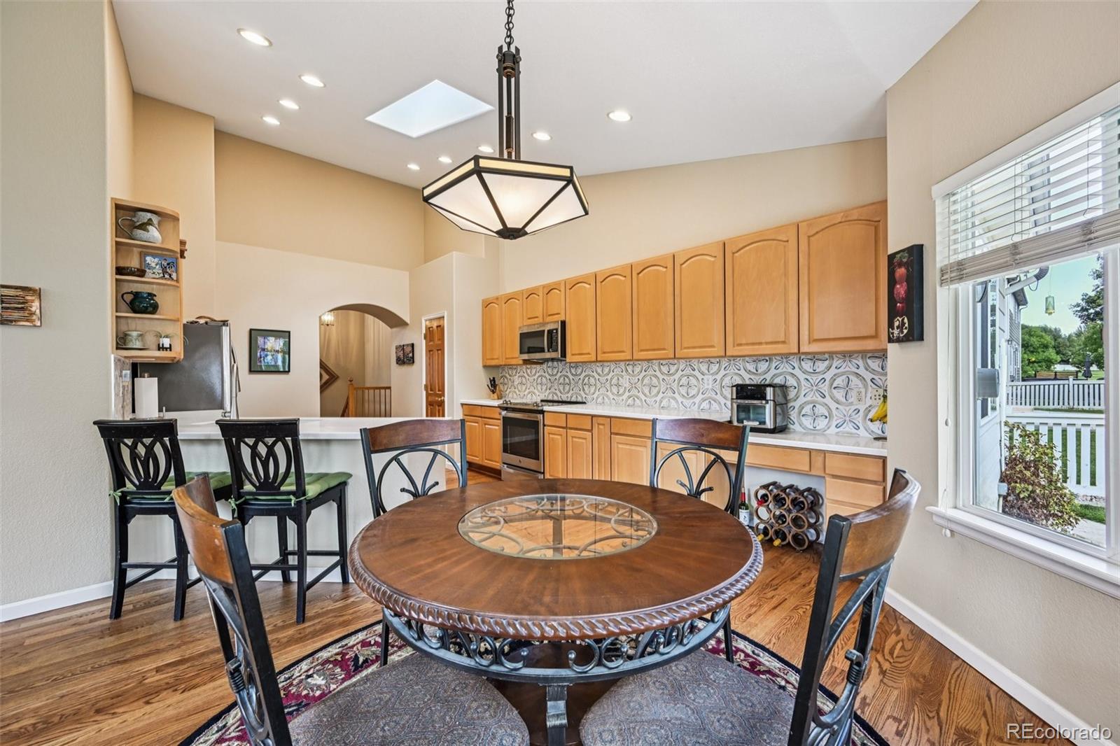 6060 Deframe Court Arvada, CO 80004 - Photo 12 of 45 a view of a dining room with furniture